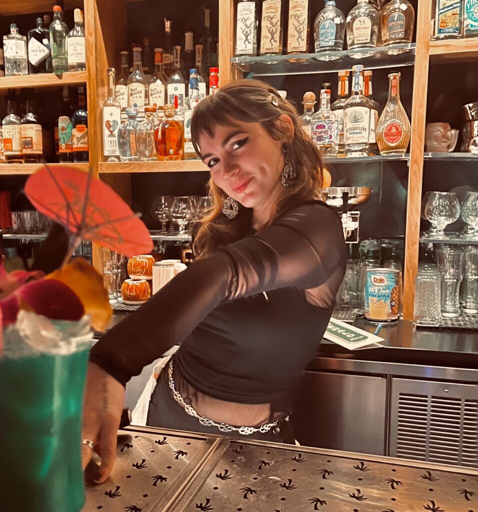 Savannah Duncan behind the bar at Emerald Lounge