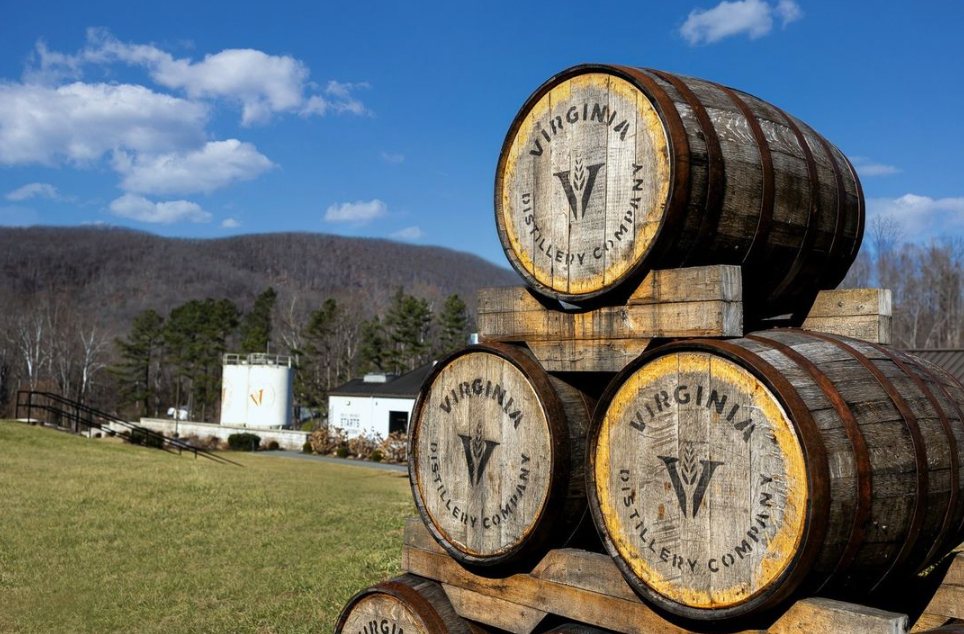 Virginia Distillery Company barrels stacked in front of the Blue Ridge Mountains