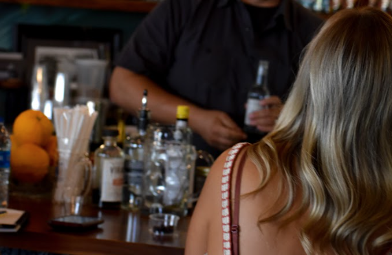 over the shoulder at a bar