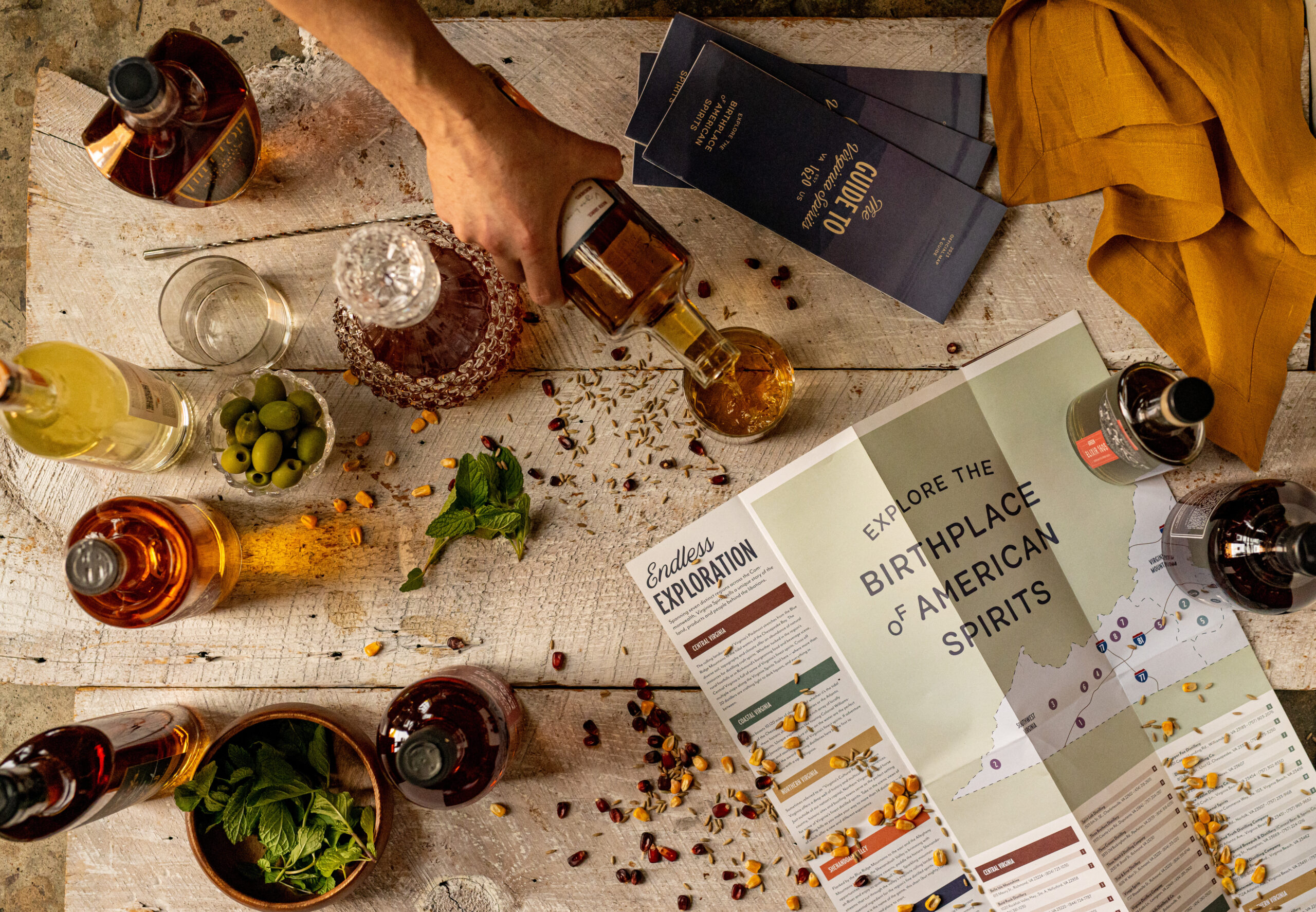 spread of Virginia spirits, garnishes and the Virginia Spirits Map