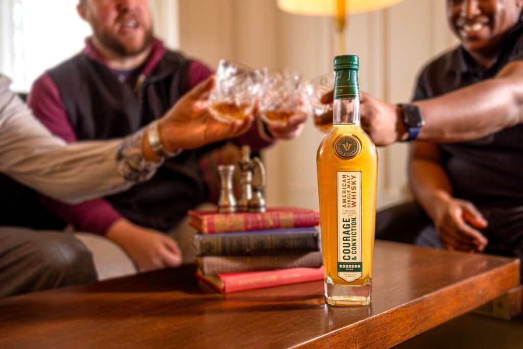 group cheers with whiskey