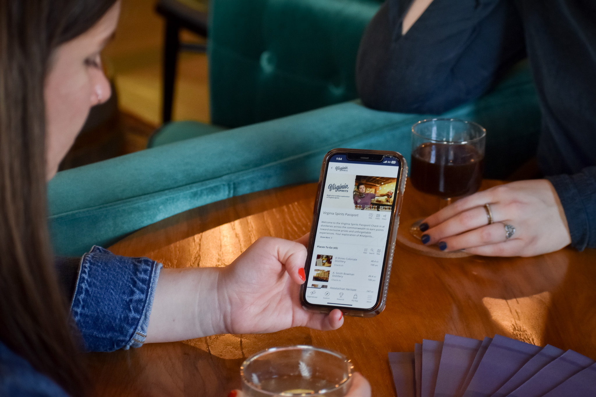 two women with cocktails and virginia spirits passport