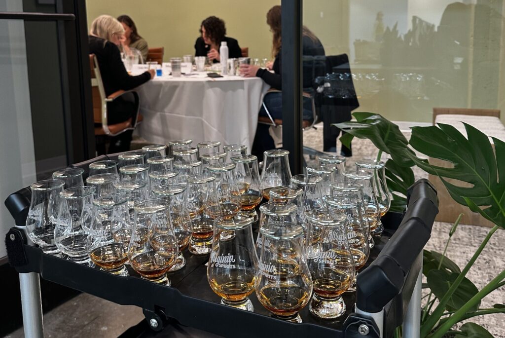 Virginia spirits tasting glasses are lined up on a cart waiting to be delivered to judges