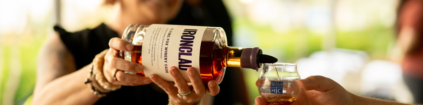 Pouring sample of Ironclad Distillery Bourbon at Virginia Distilled