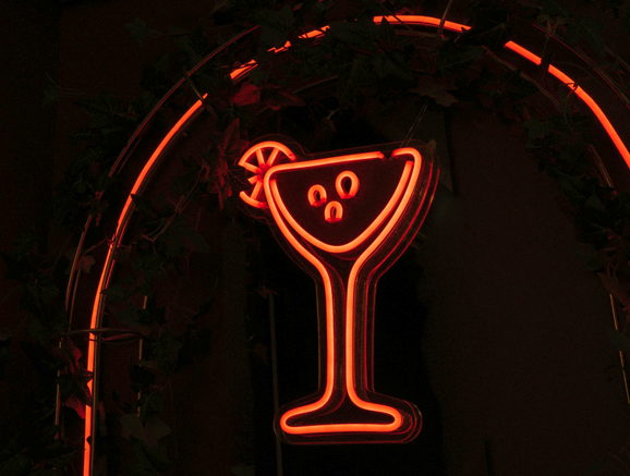 neon sign of cocktail in the dark